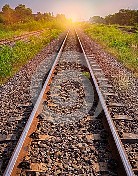 Railway tracks in sun raise moment with flair of sun