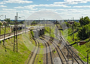 Railway tracks with switches and interchanges with Railway bridges. Wires and electric posts. High angle view with perspective. photo