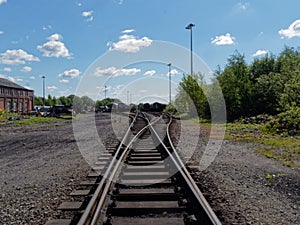 Railway tracks taken from the centre of the tracks,