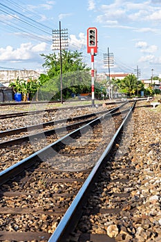 Railway tracks with traffic lights in countryside