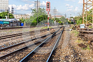 Railway tracks with traffic lights in countryside