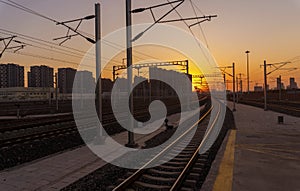 Railway Tracks At Train Station During Sunset