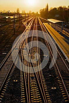 Railway Tracks at the train station at sunset.
