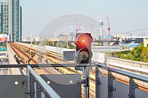 Railway traffic light in the area of a train station.