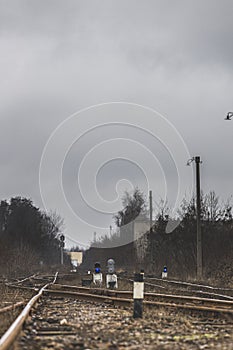 Railway traffic light with a blue standard signal. Semaphore on railroad crossing on a blurred background. Infrastructure Old