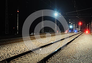 Railway and train signal at night