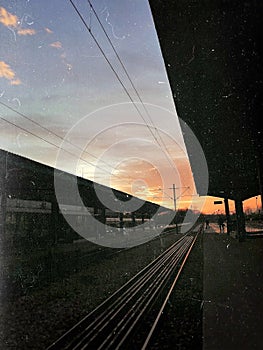 Railway train sunset wire