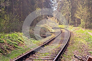 railway - the train tracks wind around curves through the forest