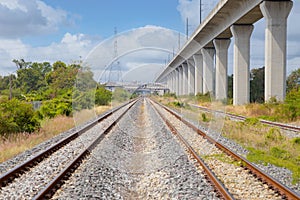 Railway Train two ways track on the ground with High Sky Train for modern city transport mass transit system