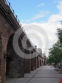 The railway viaduct that carries the Docklands light Railway past Limehouse Marina in London