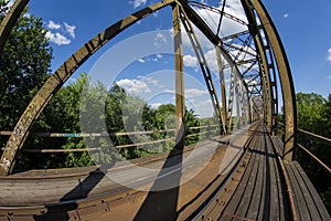 Railway viaduct in the UWA wide-angle lens on a sunny day. Summer