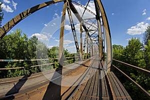 Railway viaduct in the UWA wide-angle lens on a sunny day. Summer