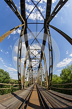 Railway viaduct in the UWA wide-angle lens on a sunny day. Summer