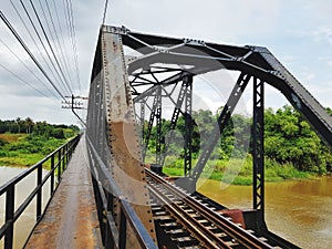 Railway and walkway on bridge across river