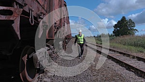 Railway worker climb up on wagon