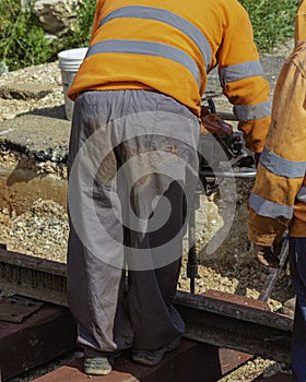 Railway workers bolting track rail.