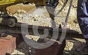 Railway workers bolting track rail.