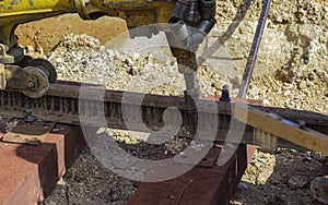 Railway workers bolting track rail.