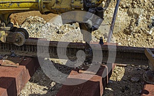 Railway workers bolting track rail.