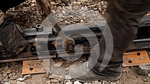 Railway workers bolting track rail