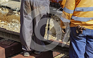 Railway workers bolting track rail. photo