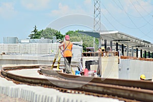 Railway Workers repairing railway on hot summer day