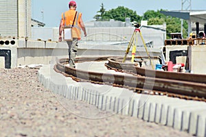 Railway Workers repairing railway on hot summer day