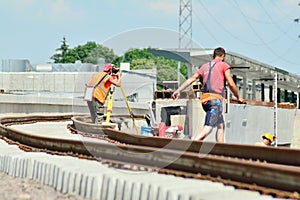 Railway Workers repairing railway on hot summer day