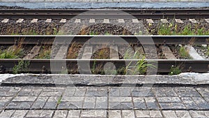 railways. Rails and sleepers on the ground near the station. Long way concept. Interlacing of tracks, railway arrows