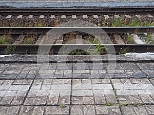 railways. Rails and sleepers on the ground near the station. Long way concept. Interlacing of tracks, railway arrows