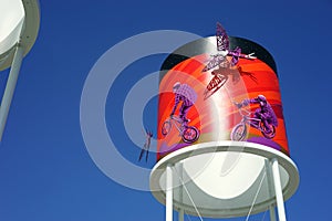 Tower with 3D dragonflies and biking - public park photo