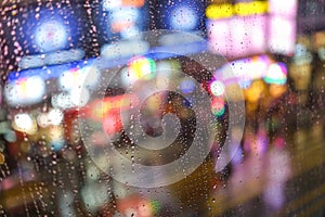 Rain abstract background with defocused lights bokeh