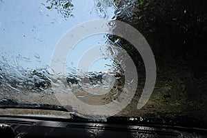 Rain behind the windshield of the car inside
