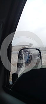 Rain car glass mirror spy door storm  cloud white wet water