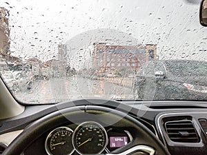 Rain on car windshield in rainy season