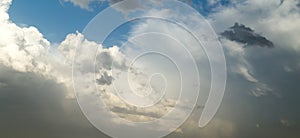 Rain clouds on a blue sky as a background