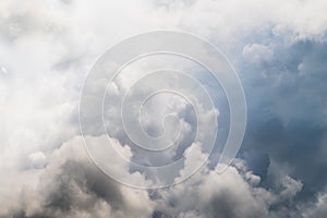 The rain clouds made the sky darkens.