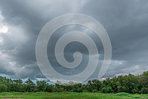 Rain clouds over the forest before a storm in rainy season.