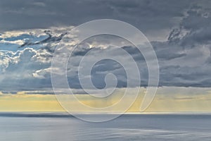 Rain clouds over Tasman sea horizon