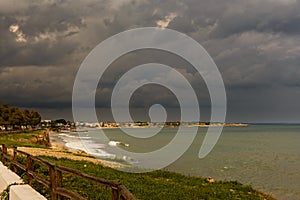 Rain clouds on the sea at the southeast coast of Sicily