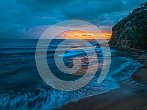 Rain clouds and sunrise at the seaside