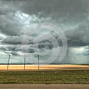 Rain clouds and wind turbines in South Texas