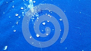 Rain drop on blue surface ,Water splash like a crown ,Water splash in crown shape and falling drop