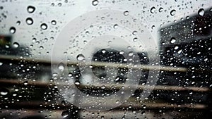 The rain drop on car\'s window pane during the raining season