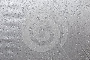 Rain drop on grey plastic background