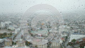 Rain drop and running down a transparant glass window