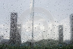 Rain droped on the window. blurred building.