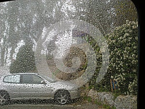 Rain droplets on car windshield