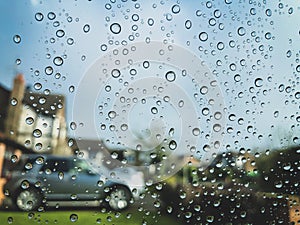 Rain droplets on glass window.