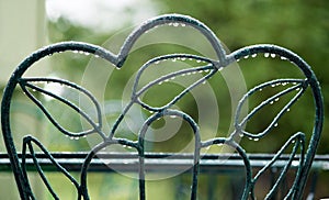 Rain Droplets on Green Chair